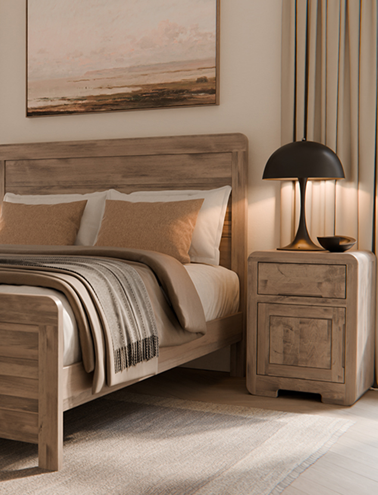 A modern Amish-crafted wooden bed frame in a natural finish with matching nightstand, styled in a serene bedroom with soft lighting, neutral bedding, and elegant decor. A stunning piece of bedroom furniture available in Hamptonville.