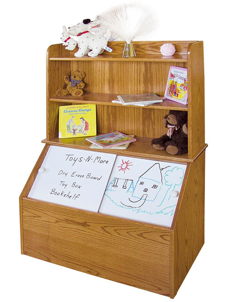 A multifunctional Amish wooden toy box and bookshelf featuring a natural oak finish, with shelves holding books, toys, and decor, and a dry erase board for added functionality. A practical and stylish piece available at one of the finest Amish stores in Hamptonville, NC.