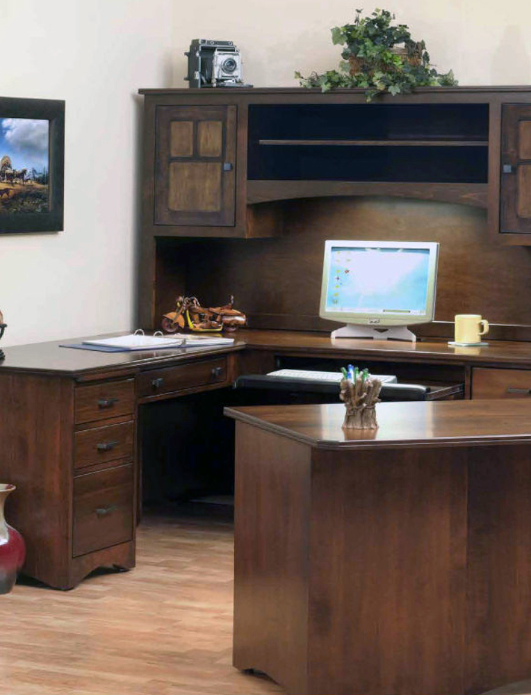 A handcrafted Amish office desk with a corner design and hutch, featuring a warm wood finish, multiple drawers, and open shelving. A classic example of premium office furniture available in Hamptonville.
