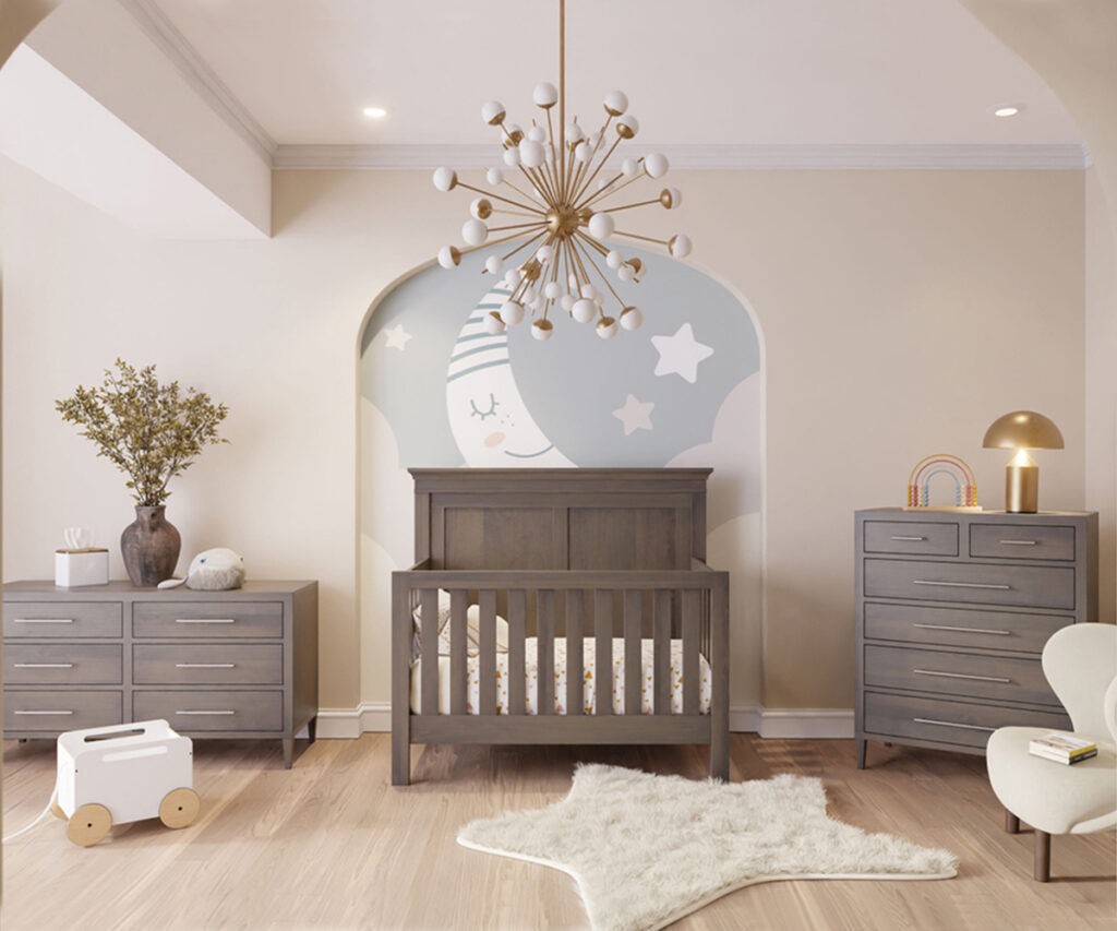 Children’s furniture nursery with gray crib, matching dressers, and star mural accent wall