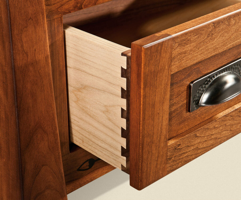 Close-up of dovetail drawer joint in handcrafted solid wood furniture
