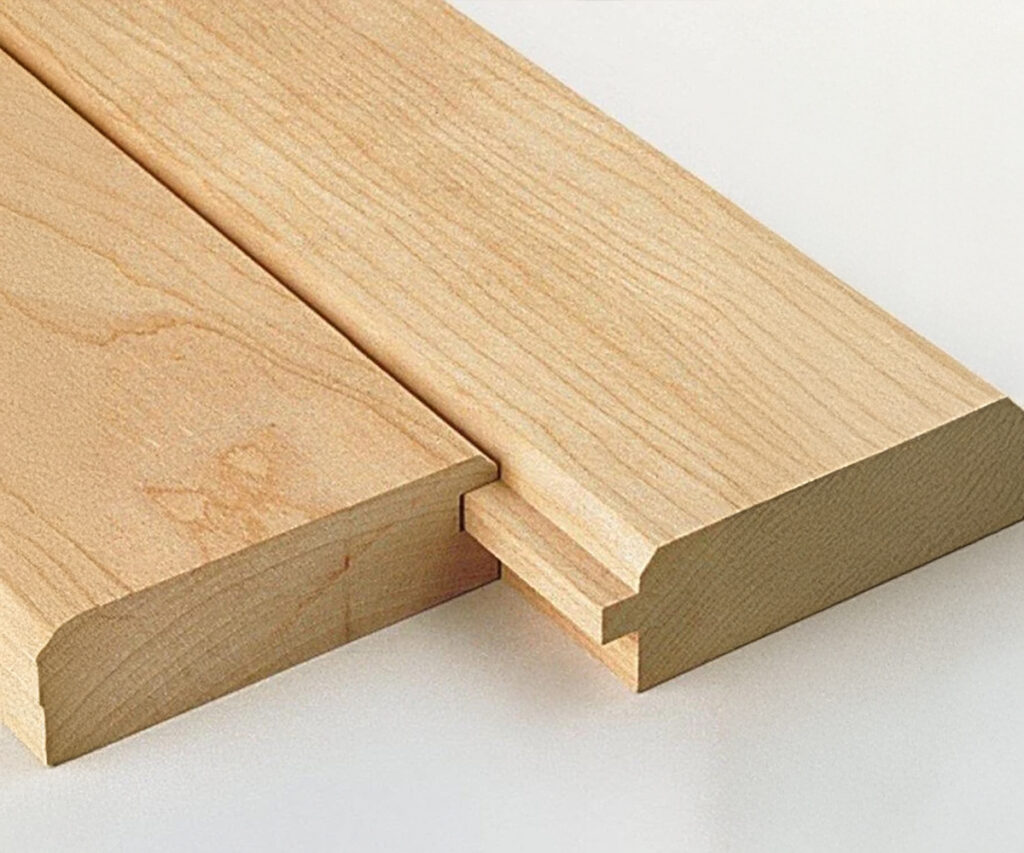 Close-up of tongue and groove boards fitting together in wood furniture construction